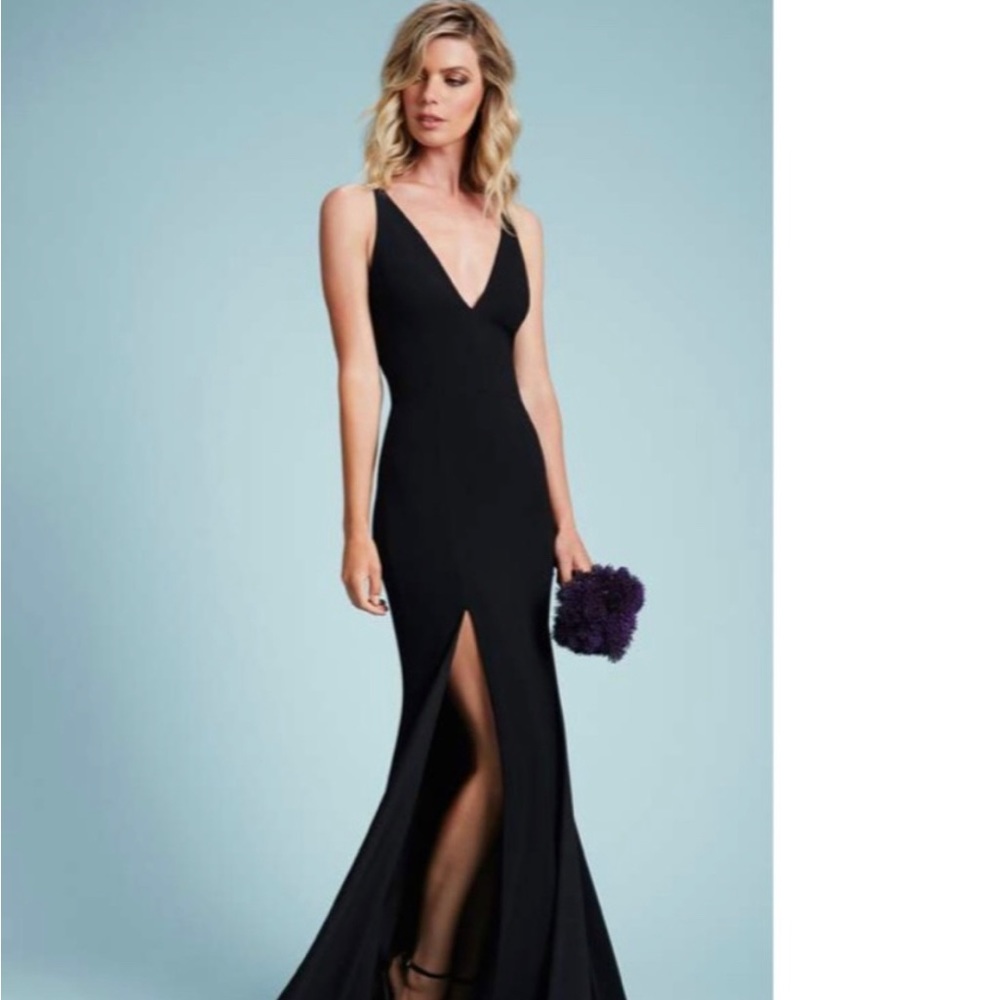 Dress the population black dress. Also available in red and green.